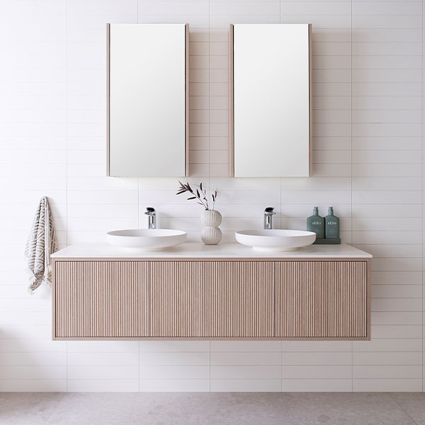 ADP Clifton 1500 Double Bowl Wall hung Vanity, Coastal Oak woodgrain cabinet finish, 12mm Bright White Cherry Pie, Margot above-counter basins (x2), Muse Mirror Cabinets in Coastal Oak.  - The Blue Space