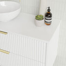 Marquis Lake Wall Hung Vanity 1200mm in Symphony Blanco top, White finish, gloss white basin, brushed brass basin mixer and top-pulled handle in side view detail - The Blue Space