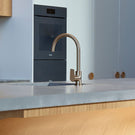 Meir Paddle Round Gooseneck Kitchen Sink Mixer Tap Champagne in Modern Kitchen Design- The Blue Space
