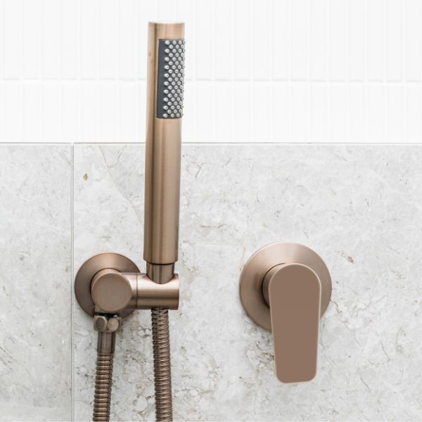 Meir Paddle Round Wall Mixer Champagne features hand shower in modern bathroom design - The Blue Space