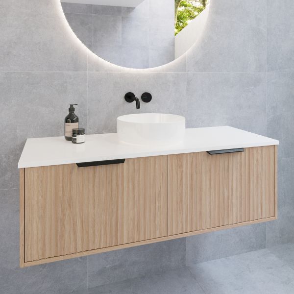 Timberline Elwood Wall Hung Vanity 1200mm With Above Counter Basin in Prime Oak finish, Matte Black basin mixer and matte black top-pulled handle features round mirror in modern bathroom design - The Blue Space
